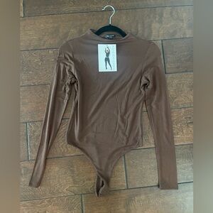 Naked Wardrobe long sleeved bodysuit. New with tags.